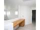 Hallway featuring built-in desk, neutral paint, hardwood floors and a hallway closet at 3440 Crystal Tower St, Las Vegas, NV 89129