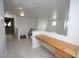 Bright hallway features light wood floors and a built-in desk, leading to a staircase and additional rooms at 3440 Crystal Tower St, Las Vegas, NV 89129