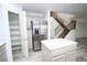 Kitchen showcases stainless steel refrigerator, island, pantry, and stairs to second level at 3440 Crystal Tower St, Las Vegas, NV 89129