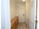 Bright laundry room features tiled floor, storage shelves, cabinets, and washer/dryer hookups at 3440 Crystal Tower St, Las Vegas, NV 89129