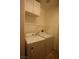 This laundry room features a washer and dryer, upper cabinets and overhead rack at 3440 Crystal Tower St, Las Vegas, NV 89129