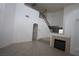 Bright living room features high ceilings, tile floors, modern fireplace, and stairway to the upper level at 3440 Crystal Tower St, Las Vegas, NV 89129