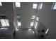 Spacious and open layout with a fireplace, tile flooring, and large windows at 3440 Crystal Tower St, Las Vegas, NV 89129