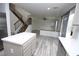Open floorplan view from kitchen showcases stairs to the second level and living room at 3440 Crystal Tower St, Las Vegas, NV 89129