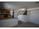 Open-concept area featuring a staircase and view of the updated kitchen at 3440 Crystal Tower St, Las Vegas, NV 89129