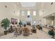 Elegant lobby with high ceilings, comfortable seating, fireplace, and natural light creating an inviting ambiance at 3440 Crystal Tower St, Las Vegas, NV 89129