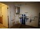 Plumbing mechanicals for the house including a water heater and filter at 3440 Crystal Tower St, Las Vegas, NV 89129