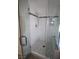 Modern glass shower with tiled walls, a showerhead, and a built-in bench, offering a luxurious bathing experience at 3440 Crystal Tower St, Las Vegas, NV 89129