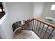 Curving staircase featuring wood railings and laminate floors, leading to a bright living space at 3440 Crystal Tower St, Las Vegas, NV 89129