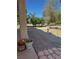 Brick patio with backyard featuring mature trees at 3551 Sagebrush Ave, Pahrump, NV 89048
