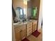 Bathroom features double sinks with granite countertops and ample vanity storage at 3551 Sagebrush Ave, Pahrump, NV 89048