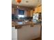 View of the kitchen from the counter overlooking sink and appliances at 3551 Sagebrush Ave, Pahrump, NV 89048