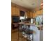 Kitchen with stainless steel appliances, wooden cabinets, and a tile backsplash at 3551 Sagebrush Ave, Pahrump, NV 89048