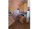 Kitchen area with wooden cabinets and a countertop workstation at 3551 Sagebrush Ave, Pahrump, NV 89048
