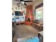Bright living room boasts a corner fireplace, large window, and ceiling fan at 3551 Sagebrush Ave, Pahrump, NV 89048