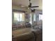 Spacious carpeted living room with a ceiling fan and a large window with views at 3551 Sagebrush Ave, Pahrump, NV 89048