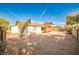 An expansive backyard with desert landscaping and a covered patio at 3596 Bronco Rd, Las Vegas, NV 89103