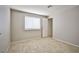 This bedroom features tile floors, a window for natural light, and neutral paint at 3596 Bronco Rd, Las Vegas, NV 89103