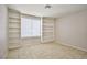 A bedroom with built-in bookshelves and a window at 3596 Bronco Rd, Las Vegas, NV 89103