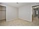 This bedroom features tile floors, a closet, and neutral paint at 3596 Bronco Rd, Las Vegas, NV 89103