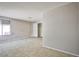 A bright bedroom with tile flooring, a large window, and a closet at 3596 Bronco Rd, Las Vegas, NV 89103