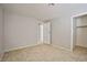 This bedroom features tile floors, a closet and neutral paint at 3596 Bronco Rd, Las Vegas, NV 89103