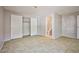 Neutral bedroom with closet and attached bathroom. Tile floors throughout at 3596 Bronco Rd, Las Vegas, NV 89103
