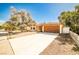 Charming single story home with mature trees and landscaping, plus a two car garage at 3596 Bronco Rd, Las Vegas, NV 89103