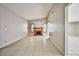An empty living room with a fireplace, tile floors, and fresh paint at 3596 Bronco Rd, Las Vegas, NV 89103
