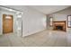 Open-concept home with a stained wood front door and charming brick fireplace, tile floors, natural light at 3596 Bronco Rd, Las Vegas, NV 89103