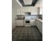 A kitchen featuring white cabinets, gray countertops, and tile flooring at 3692 Garden South Dr # 0, Las Vegas, NV 89121