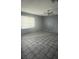 An empty living room showcasing natural light and tile flooring at 3692 Garden South Dr # 0, Las Vegas, NV 89121