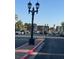 Well-maintained parking lot with vintage street lamps and mature trees offering ample spaces at 3692 Garden South Dr # 0, Las Vegas, NV 89121