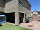 Enclosed backyard with brick patio, lush green lawn, and shaded porch at 3855 Park Field Dr, Las Vegas, NV 89120