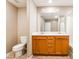 Bathroom featuring dual sinks with a toilet and tub at 3855 Park Field Dr, Las Vegas, NV 89120