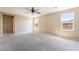 Spacious bedroom with neutral walls, carpeted floor and ceiling fan at 3855 Park Field Dr, Las Vegas, NV 89120