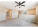 Upstairs loft featuring neutral walls, ceiling fan, carpet, and natural light at 3855 Park Field Dr, Las Vegas, NV 89120