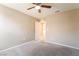 Bright bedroom featuring neutral walls, carpet flooring, and a ceiling fan for added comfort at 3855 Park Field Dr, Las Vegas, NV 89120