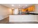This is a kitchen with wood cabinets, stainless steel appliances, and sleek countertops at 3855 Park Field Dr, Las Vegas, NV 89120