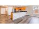 Open concept kitchen with stainless steel appliances and gray wood-look vinyl plank flooring at 3855 Park Field Dr, Las Vegas, NV 89120