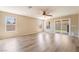 Spacious living room with recessed lighting, wood flooring, base molding, and sliding glass doors to backyard at 3855 Park Field Dr, Las Vegas, NV 89120