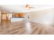 Open floorplan living room features wood flooring, a half wall to kitchen with breakfast bar, and recessed lighting at 3855 Park Field Dr, Las Vegas, NV 89120