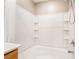 Clean, white tiled tub with a shower head and built in shelves at 3855 Park Field Dr, Las Vegas, NV 89120