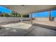 Covered back patio overlooking a large backyard with concrete slab perfect for outdoor entertaining at 4010 Herblinda Ln, North Las Vegas, NV 89032