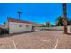 Backyard view showcasing the home's tiled roof, large backyard space and potential at 4010 Herblinda Ln, North Las Vegas, NV 89032