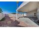 Spacious backyard with a covered patio, rock landscaping, and privacy fence at 4010 Herblinda Ln, North Las Vegas, NV 89032