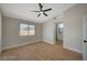 Inviting bedroom with en-suite bathroom access and modern ceiling fan at 4010 Herblinda Ln, North Las Vegas, NV 89032