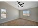 Bright bedroom with wood-look flooring, ceiling fan, and natural light at 4010 Herblinda Ln, North Las Vegas, NV 89032