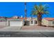 Charming single-story home featuring a well-maintained front yard with mature palm trees and a two car garage at 4010 Herblinda Ln, North Las Vegas, NV 89032