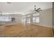 Open-concept living space featuring new floors, vaulted ceiling, and modern kitchen with stainless steel appliances at 4010 Herblinda Ln, North Las Vegas, NV 89032
